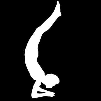 Negative silhouette of a female person performing the yoga exercise Scorpion Vrischikasana.