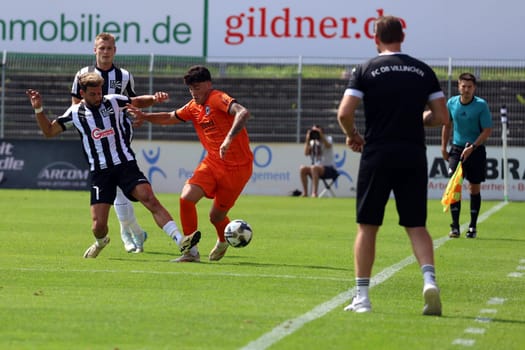 Mario Klotz (FC 08 Villingen head coach) watches the action,Tevfik Ceylan (FC 08 Villingen) chases the ball away from his Frankfurt opponent in the match of the football RL SW 24-25: 6. Sptg: FC 08 Villingen vs Eintracht Frankfurt U21