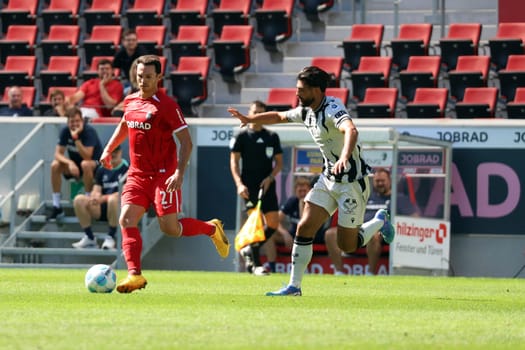 Nicolas Höfler (SC Freiburg) in a duel with Nicolas Vouilloz (FC Basel) in the football test match: SC Freiburg - FC Basel  REGULATIONS PROHIBIT ANY USE OF PHOTOGRAPHS AS IMAGE SEQUENCES AND/OR QUASI-VIDEONann  Photo: Joachim Hahne/johapress