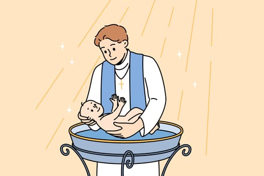 Ritual of baptism for baby is carried out by priest, dipping newborn into holy water inside church building. Baptism procedure in christian religion, for blessing son of catholic mom and dad