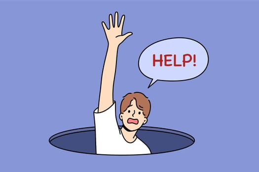 Man fallen into hole screams for help and raises hand, for concept of panic attack and helplessness. Panic attack in guy at risk of going crazy due to severe depression and mental disorder