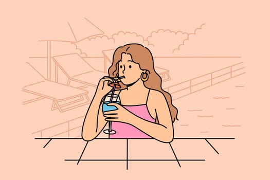 Woman drinks cocktail and swims in pool, enjoying vacation in cool hotel in hot summer weather. Tourist girl swims in pool while at weekend, restoring strength after difficult work