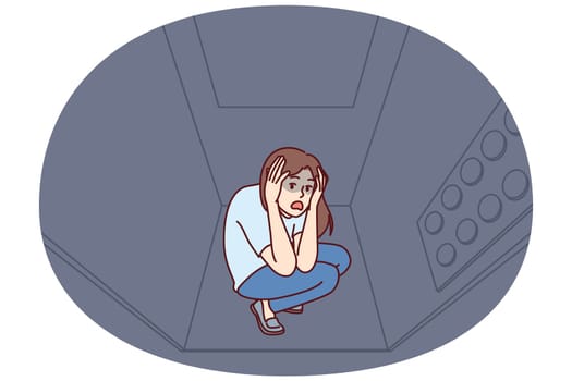 Woman stuck in elevator is claustrophobia and panic attack due to phobia of enclosed spaces. Young girl rides in moving elevator in need of psychological help to treat claustrophobia