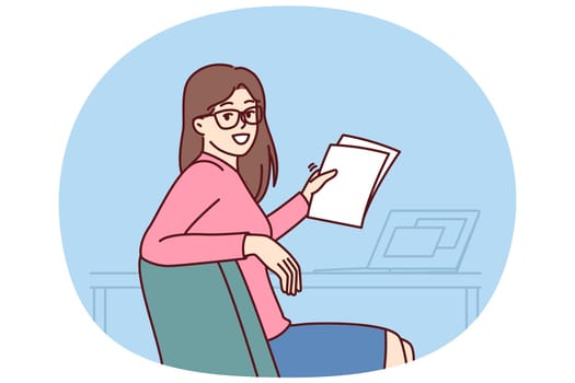Successful woman office worker holds papers and sits at table with laptop making career as accountant or lawyer. Successful businesswoman turning around and looking at camera while doing paperwork