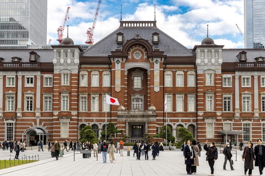 Tourists walking in front of tokyo station marunouchi building in japan