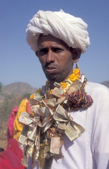 Traditional dresst Rajasthani Men at a traditional Funeral in the Town of Pushkar in the Province of Rajasthan in India.  India, Pushkar, January, 1998