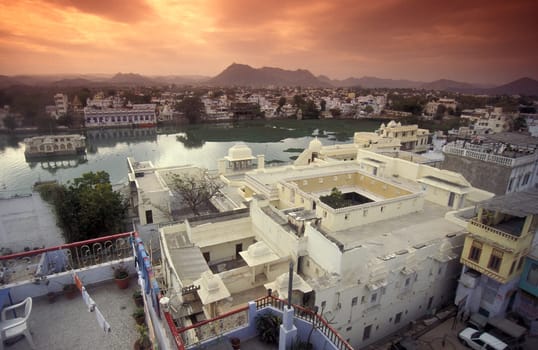 Architectur with Palace and Houses on the Pichhola Lake in the Town of Udaipur in the Province of Rajasthan in India.  India, Udaipur, January, 1998