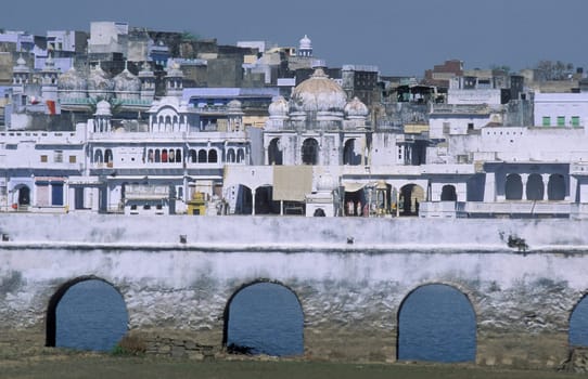Architectur with Palace and Houses on the Pichhola Lake in the Town of Udaipur in the Province of Rajasthan in India.  India, Udaipur, January, 1998