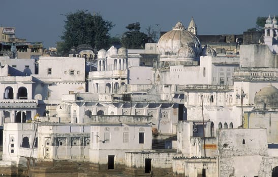Architectur with Palace and Houses on the Pichhola Lake in the Town of Udaipur in the Province of Rajasthan in India.  India, Udaipur, January, 1998