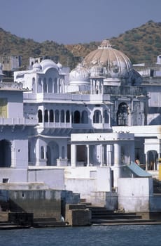 Architectur with Palace and Houses on the Pichhola Lake in the Town of Udaipur in the Province of Rajasthan in India.  India, Udaipur, January, 1998