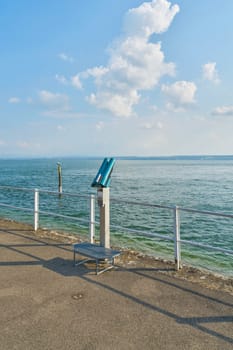 Telescope to enjoy the view on the shores of Lake Constance near Meersburg in Germany
