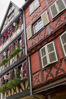 Facades of historic half-timbered houses in the old town of Colmar in France