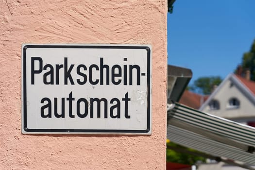Sign for a parking machine in the old town of Lindau in Germany. Translation: Parking ticket machine