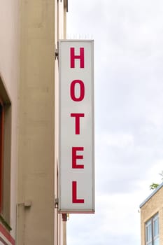 Illuminated sign for a hotel in the old town of Cologne in Germany