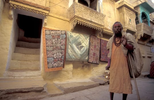 a street Sadhu in the old Town in the Jaisalmer Fort with the city of Jaisalmer in the Province of Rajasthan in India.  India, Jaisalmer, January, 1998