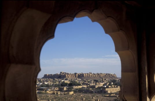 a view of the Jaisalmer Fort with the city of Jaisalmer in the Province of Rajasthan in India.  India, Jaisalmer, January, 1998