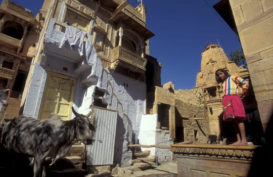 a Child is playing in the old Town in the Jaisalmer Fort with the city of Jaisalmer in the Province of Rajasthan in India.  India, Jaisalmer, January, 1998
