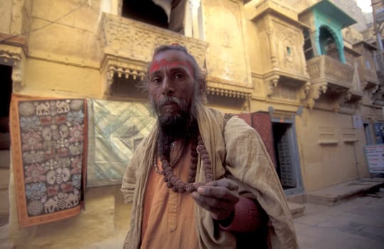 a street Sadhu in the old Town in the Jaisalmer Fort with the city of Jaisalmer in the Province of Rajasthan in India.  India, Jaisalmer, January, 1998