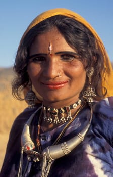 a portrait of a Rajasthani women in the Town of Jaisalmer in the Province of Rajasthan in India.  India, Jaisalmer, January, 1998