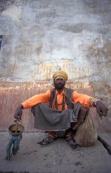 a street Sadhu in the old Town in the Jaisalmer Fort with the city of Jaisalmer in the Province of Rajasthan in India.  India, Jaisalmer, January, 1998