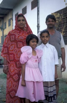 a Rajasthani Family posing in the Town of Jaisalmer in the Province of Rajasthan in India.  India, Jaisalmer, January, 1998