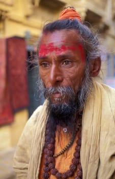 a street Sadhu in the old Town in the Jaisalmer Fort with the city of Jaisalmer in the Province of Rajasthan in India.  India, Jaisalmer, January, 1998