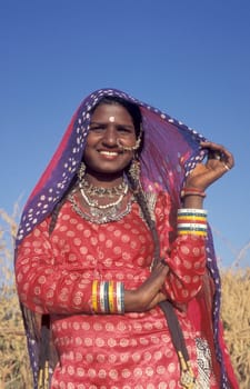 a portrait of a Rajasthani women in the Town of Jaisalmer in the Province of Rajasthan in India.  India, Jaisalmer, January, 1998
