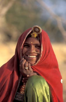 a portrait of a Rajasthani women in the Town of Jaisalmer in the Province of Rajasthan in India.  India, Jaisalmer, January, 1998