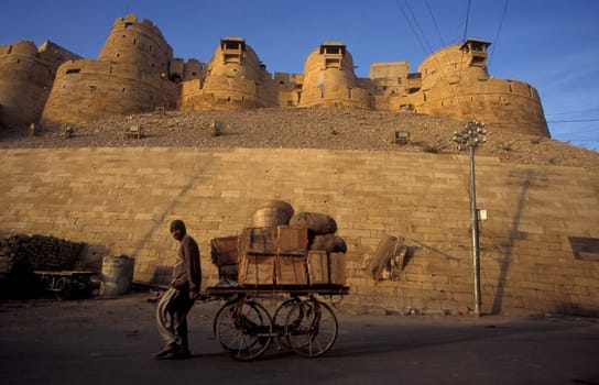 a alley in the old Town with the Jaisalmer Fort in the city of Jaisalmer in the Province of Rajasthan in India.  India, Jaisalmer, January, 1998