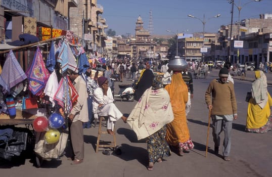 a streetmarket at a square in the city of Jaisalmer in the Province of Rajasthan in India.  India, Jaisalmer, January, 1998