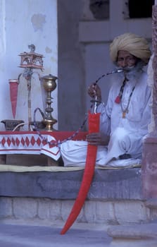a portrait of a Rajasthani men in the Town of Jaisalmer in the Province of Rajasthan in India.  India, Jaisalmer, January, 1998