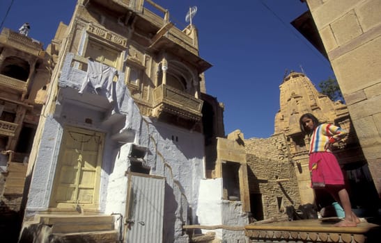 a Child is playing in the old Town in the Jaisalmer Fort with the city of Jaisalmer in the Province of Rajasthan in India.  India, Jaisalmer, January, 1998