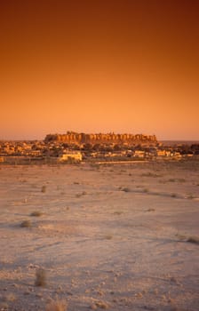 a view of the Jaisalmer Fort with the city of Jaisalmer in the Province of Rajasthan in India.  India, Jaisalmer, January, 1998