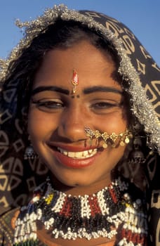 a portrait of a Rajasthani women in the Town of Jaisalmer in the Province of Rajasthan in India.  India, Jaisalmer, January, 1998