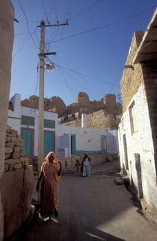 a alley in the old Town with the Jaisalmer Fort in the city of Jaisalmer in the Province of Rajasthan in India.  India, Jaisalmer, January, 1998