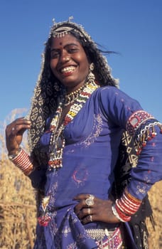 a portrait of a Rajasthani women in the Town of Jaisalmer in the Province of Rajasthan in India.  India, Jaisalmer, January, 1998