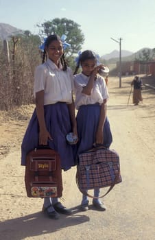 School Children on a street in the Town of Jaisalmer in the Province of Rajasthan in India.  India, Jaisalmer, January, 1998