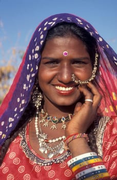 a portrait of a Rajasthani women in the Town of Jaisalmer in the Province of Rajasthan in India.  India, Jaisalmer, January, 1998