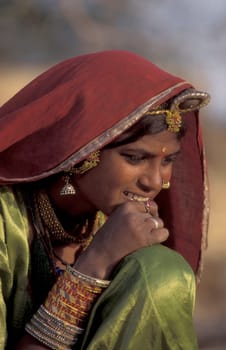 a portrait of a Rajasthani women in the Town of Jaisalmer in the Province of Rajasthan in India.  India, Jaisalmer, January, 1998
