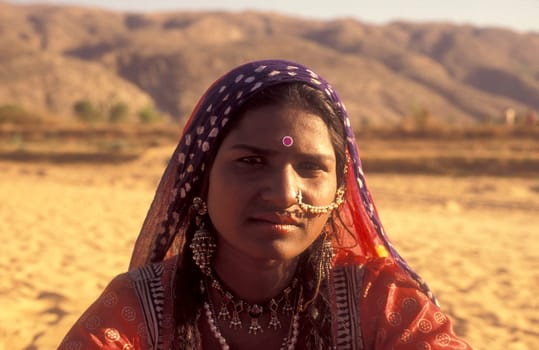 a portrait of a Rajasthani women in the Town of Jaisalmer in the Province of Rajasthan in India.  India, Jaisalmer, January, 1998