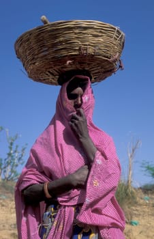 a portrait of a Rajasthani women in the Town of Jaisalmer in the Province of Rajasthan in India.  India, Jaisalmer, January, 1998