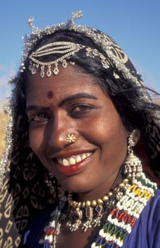 a portrait of a Rajasthani women in the Town of Jaisalmer in the Province of Rajasthan in India.  India, Jaisalmer, January, 1998