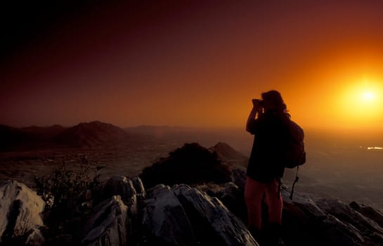 a sunset in the Thar Desert near the Town of Jaisalmer in the Province of Rajasthan in India.  India, Jaisalmer, January, 1998