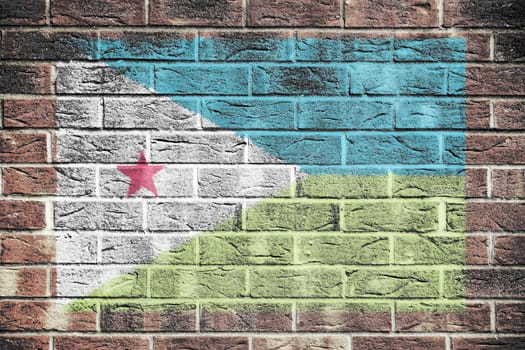 A Djbouti flag painted on brick wall background