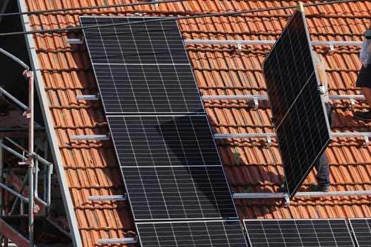 Installation of a photovoltaic system on a house roof