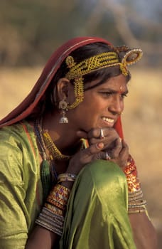 a portrait of a Rajasthani women in the Town of Jaisalmer in the Province of Rajasthan in India.  India, Jaisalmer, January, 1998