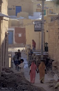 two Rajasthani women at a construction work in the Town of Jaisalmer in the Province of Rajasthan in India.  India, Jaisalmer, January, 1998
