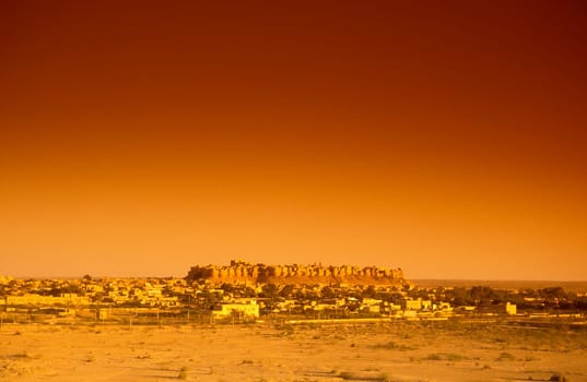 a view of the Jaisalmer Fort with the city of Jaisalmer in the Province of Rajasthan in India.  India, Jaisalmer, January, 1998