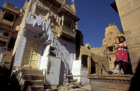 a Child is playing in the old Town in the Jaisalmer Fort with the city of Jaisalmer in the Province of Rajasthan in India.  India, Jaisalmer, January, 1998