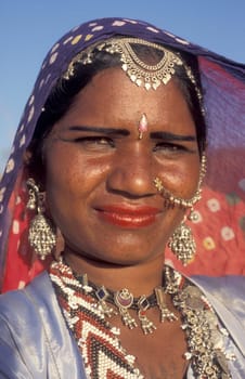 a portrait of a Rajasthani women in the Town of Jaisalmer in the Province of Rajasthan in India.  India, Jaisalmer, January, 1998